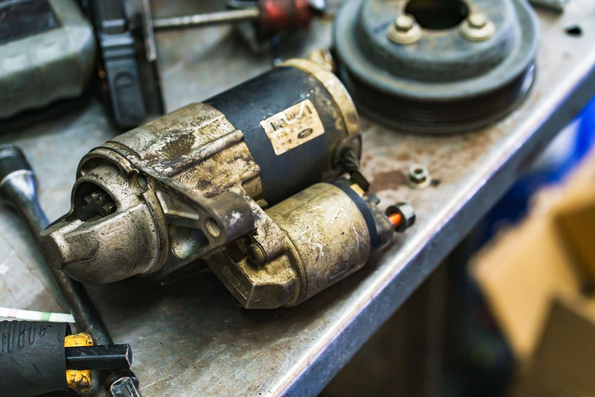 Starter motor on the workbench during an electrical repair